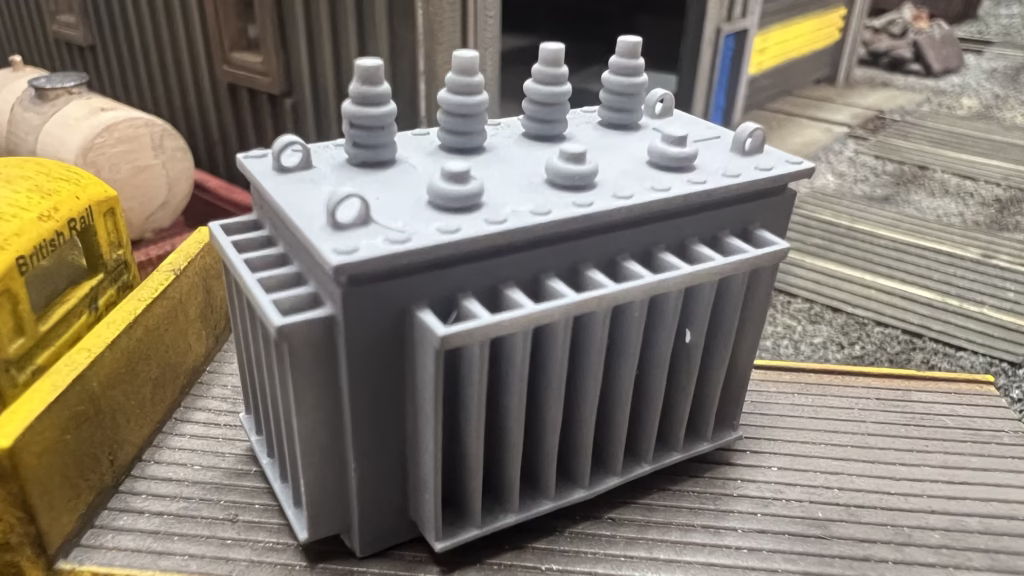 Close-up of HO scale 3D printed model railroad detail showing crisp resin texture