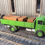 Photo of an HO Scale 3D printed model of packing crates and boxes for a model railroad