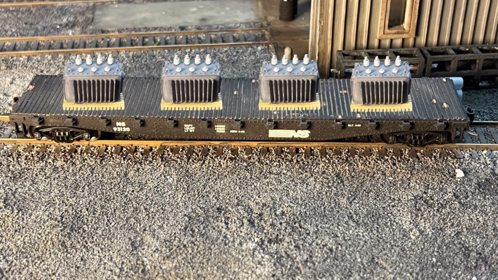 Photo of an HO Scale 3D printed model of a large electrical transformer for a model railroad