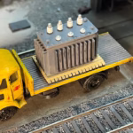 Photo of an HO Scale 3D printed model of a large electrical transformer for a model railroad