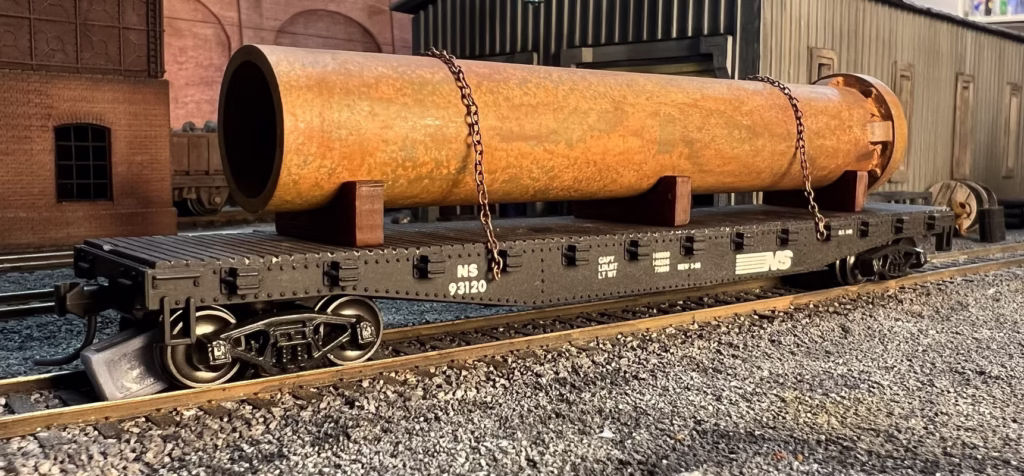 HO scale large pipe car load with blocking and chains