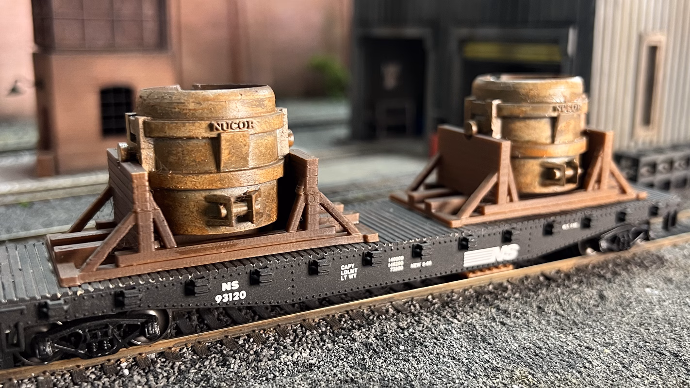 Photo of an HO Scale 3D printed model of a steel mill ladle on a pallet for a model railroad