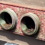 Photo of a HO Scale 3D printed model of a waste water drain outlet in brick for a model railroad