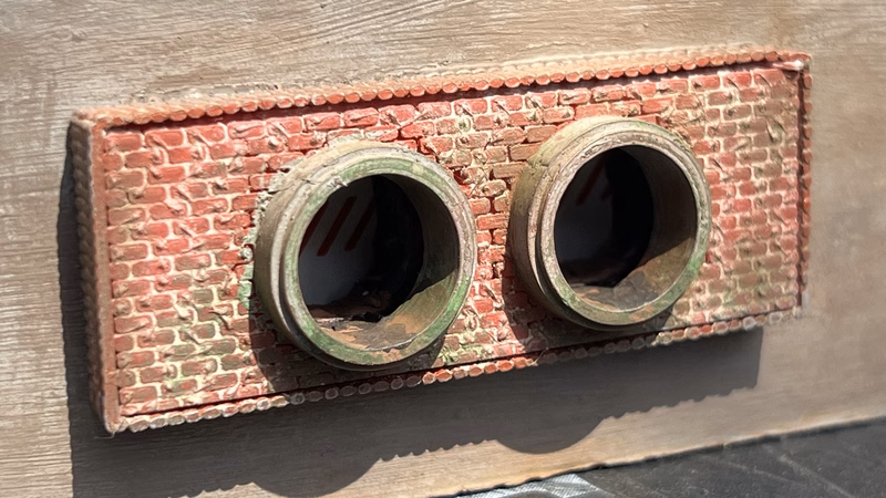 Photo of a HO Scale 3D printed model of a waste water drain outlet in brick for a model railroad