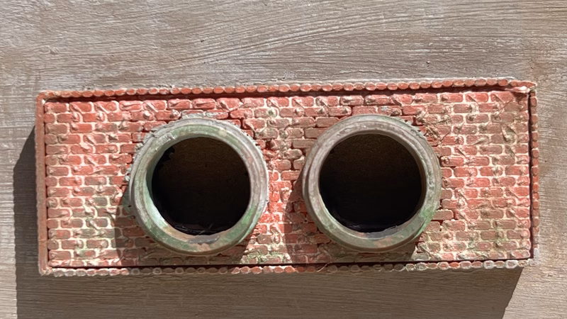 Photo of a HO Scale 3D printed model of a waste water drain outlet in brick for a model railroad