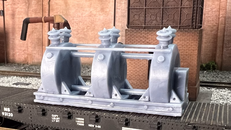 Photo of an HO Scale 3D printed model of a large electrical transformer for a model railroad