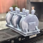 Photo of an HO Scale 3D printed model of a large electrical transformer for a model railroad