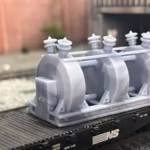 Photo of an HO Scale 3D printed model of a large electrical transformer for a model railroad