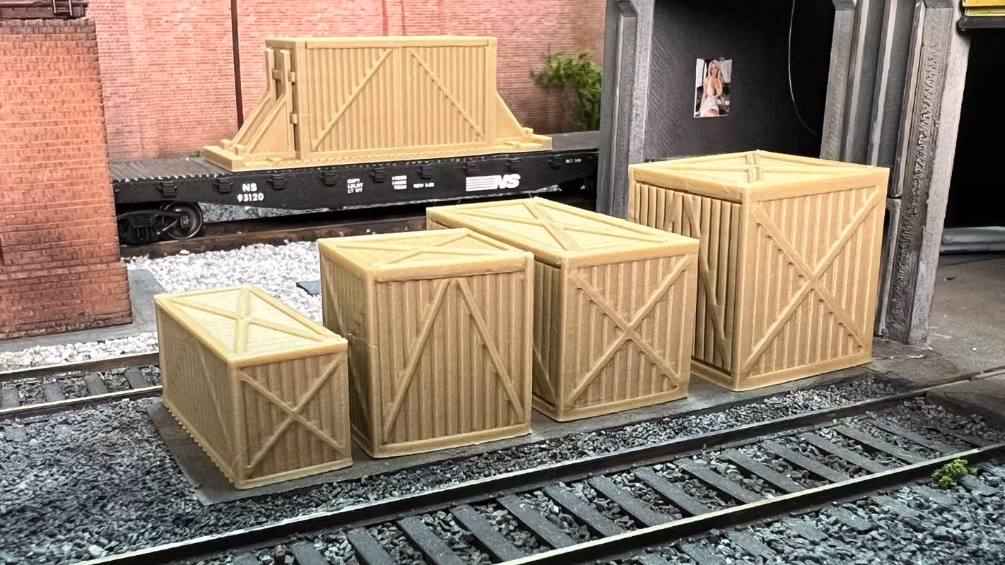 Photo of an HO Scale 3D printed model of large box crates for a model railroad similar to Chooch