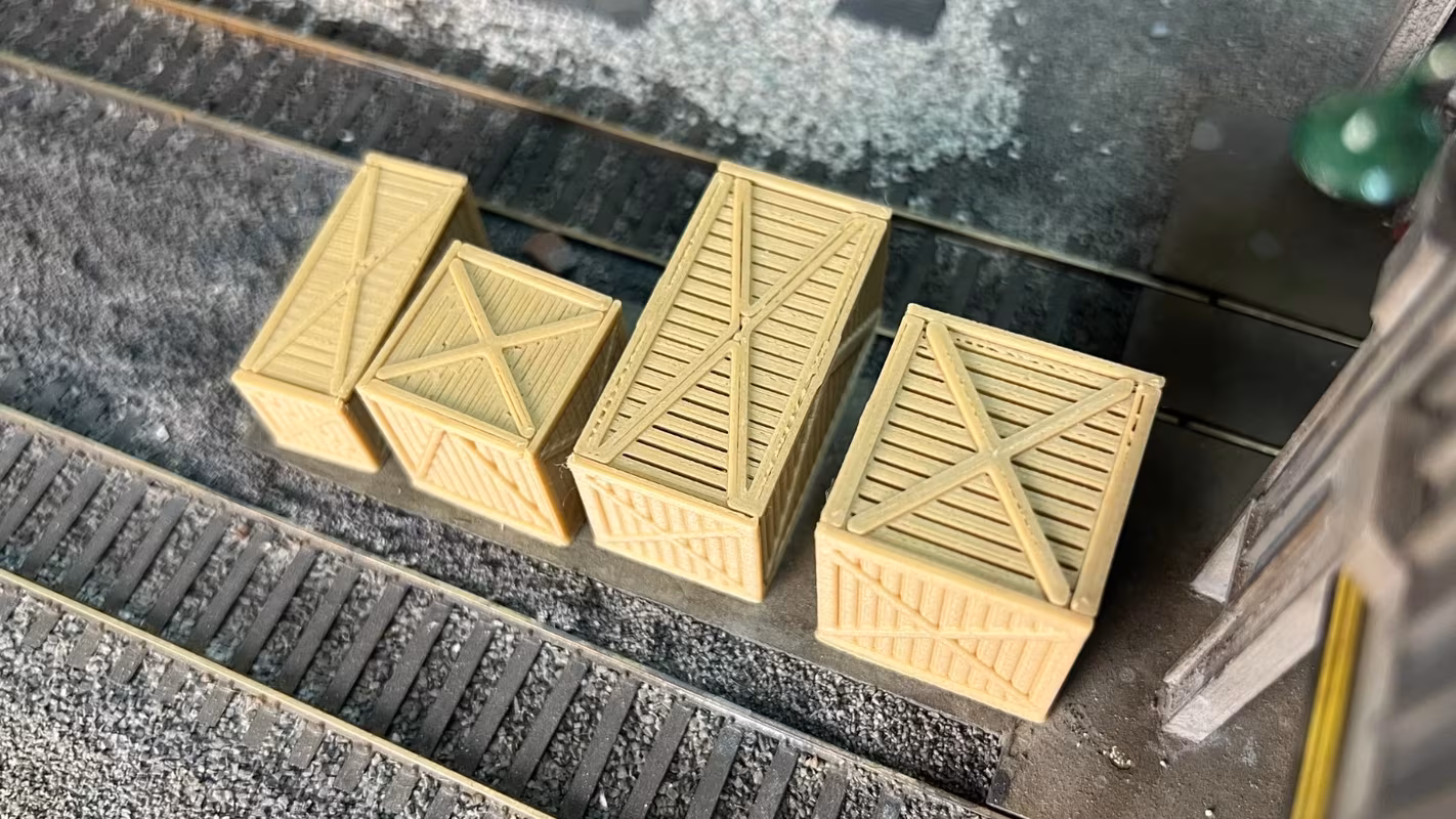 Photo of an HO Scale 3D printed model of large box crates for a model railroad similar to Chooch
