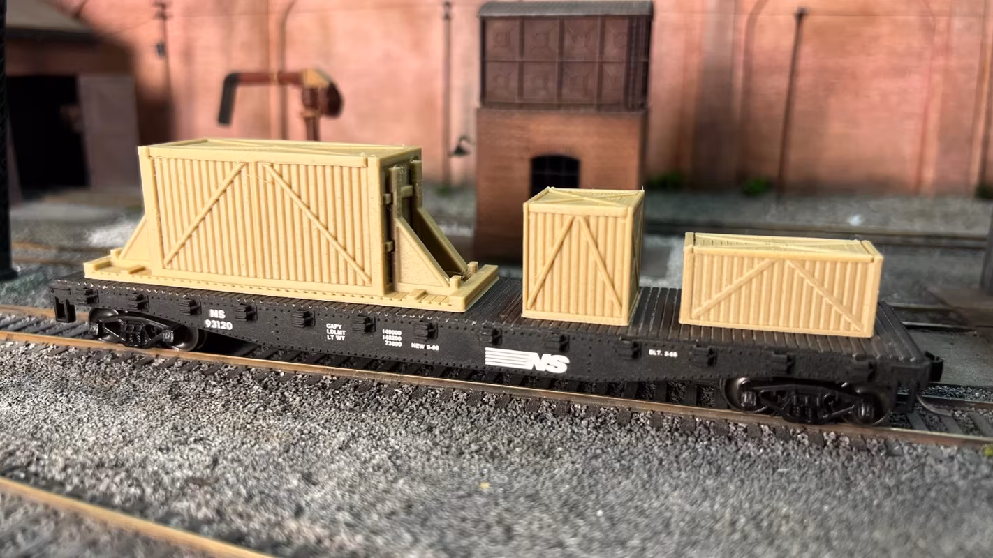 Photo of an HO Scale 3D printed model of large box crates for a model railroad similar to Chooch