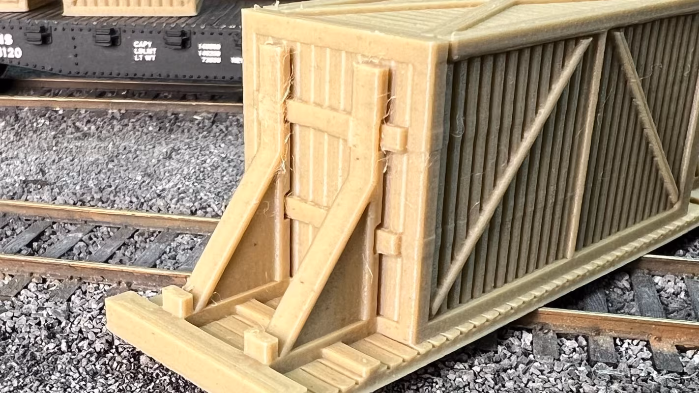 Photo of an HO Scale 3D printed model of large box crates for a model railroad similar to Chooch