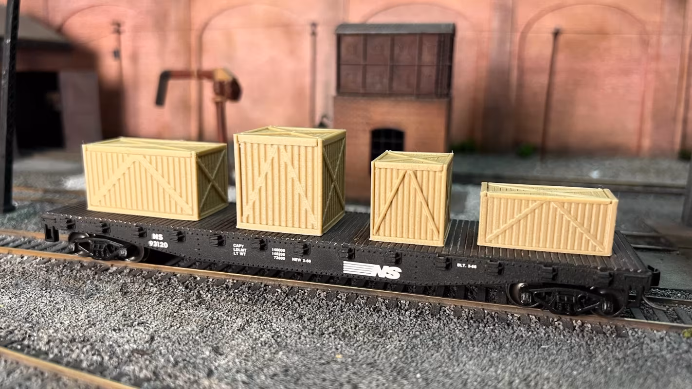 Photo of an HO Scale 3D printed model of large box crates for a model railroad similar to Chooch