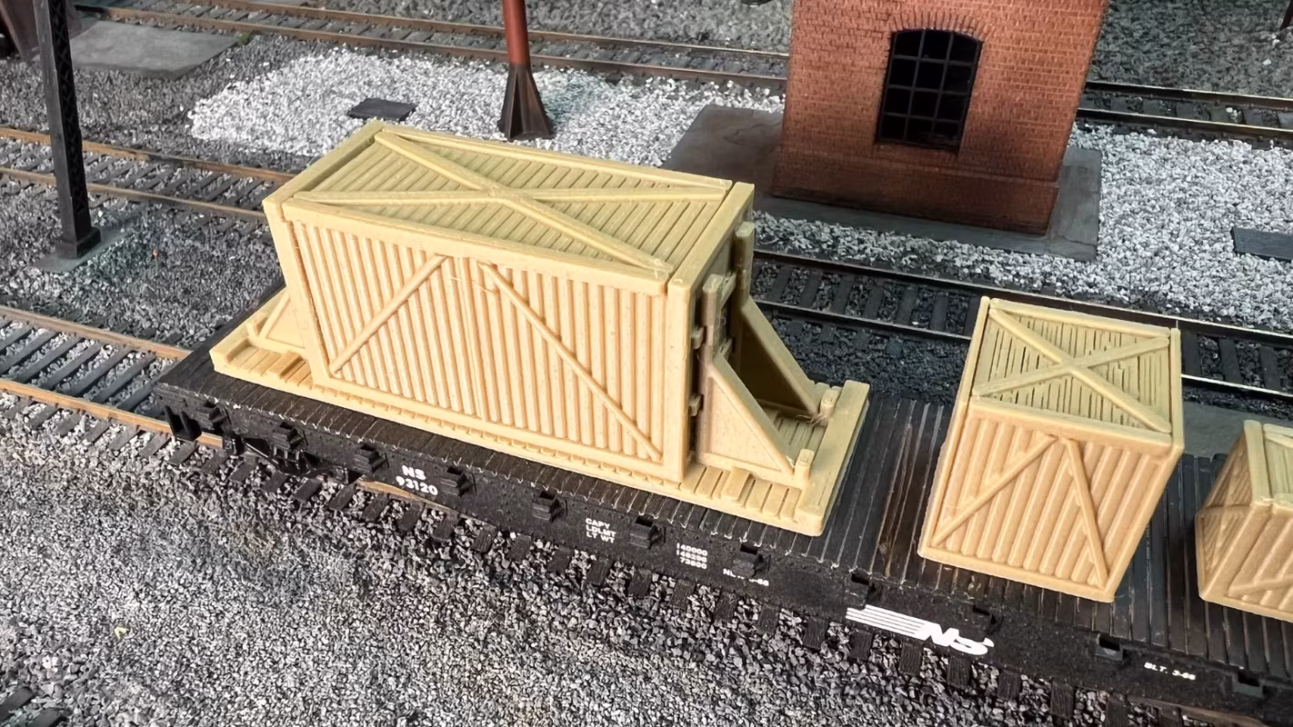 Photo of an HO Scale 3D printed model of large box crates for a model railroad similar to Chooch