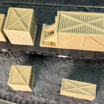 Photo of an HO Scale 3D printed model of large box crates for a model railroad similar to Chooch