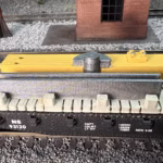 Photo of a HO Scale 3D printed model of an oil pump on a pallet for a model railroad