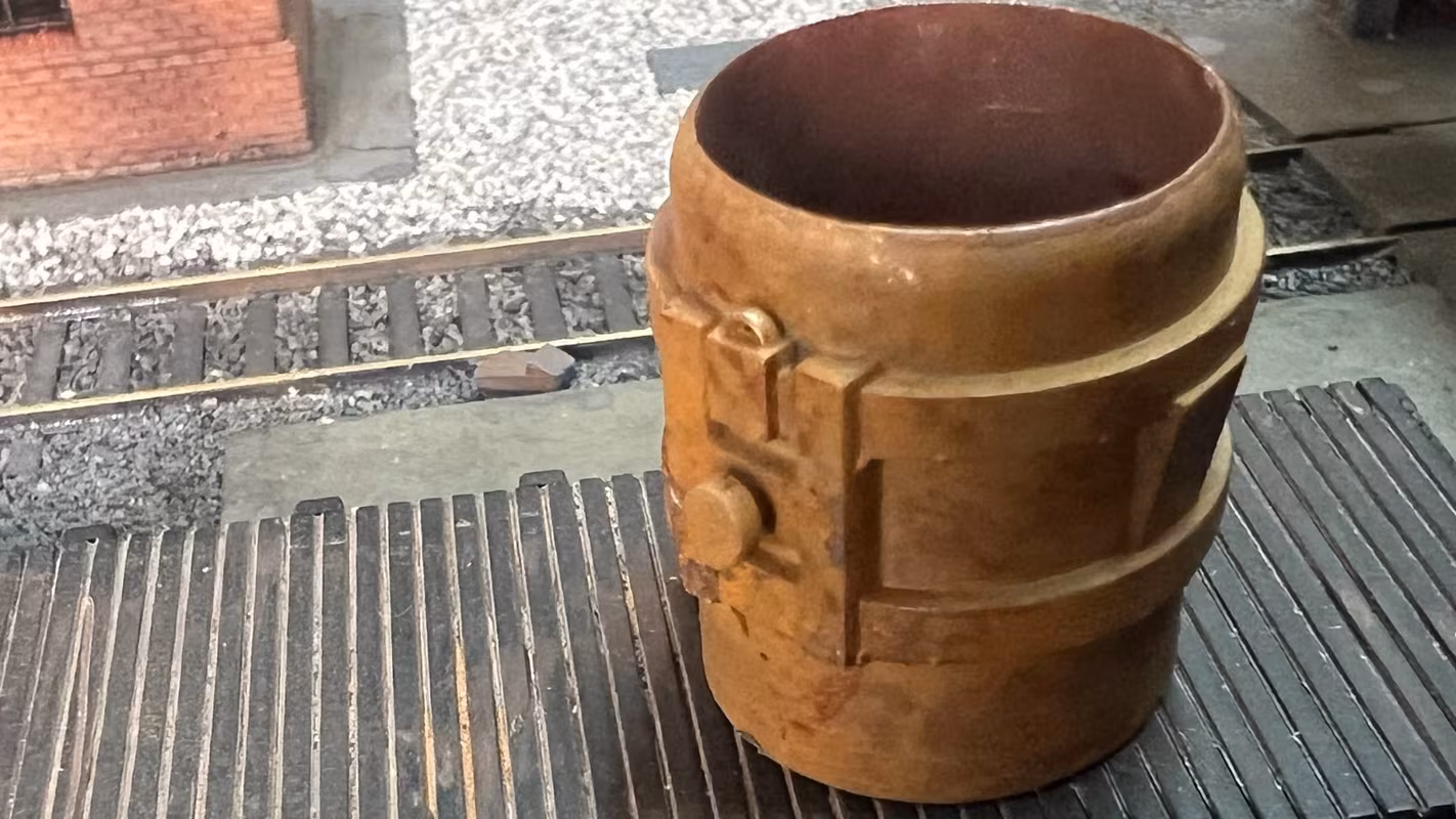Photo of an HO Scale 3D printed model of a steel mill ladle on a pallet for a model railroad