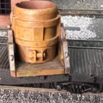 Photo of an HO Scale 3D printed model of a steel mill ladle on a pallet for a model railroad