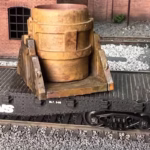 Photo of an HO Scale 3D printed model of a steel mill ladle on a pallet for a model railroad