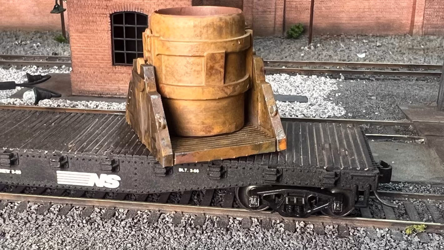 Photo of an HO Scale 3D printed model of a steel mill ladle on a pallet for a model railroad