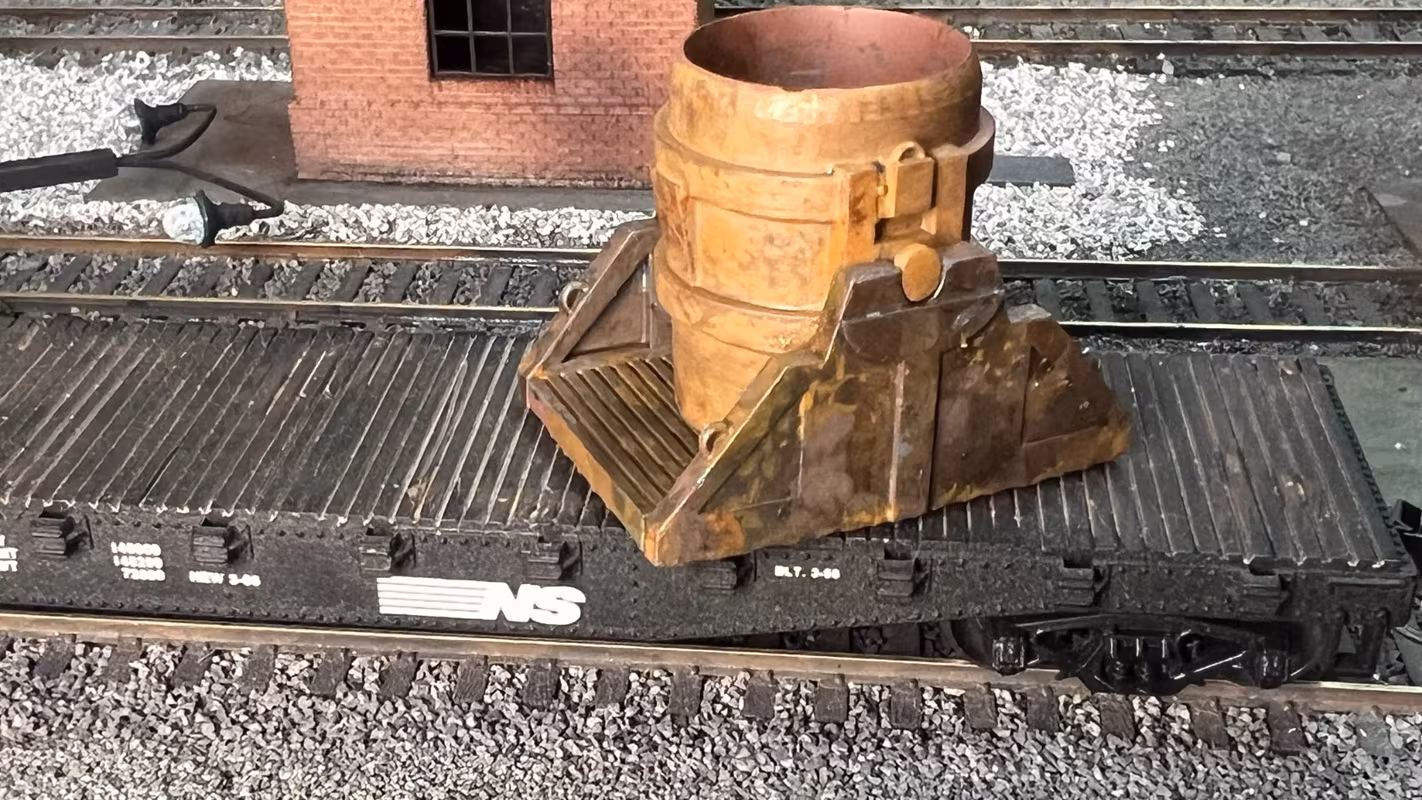 Photo of an HO Scale 3D printed model of a steel mill ladle on a pallet for a model railroad