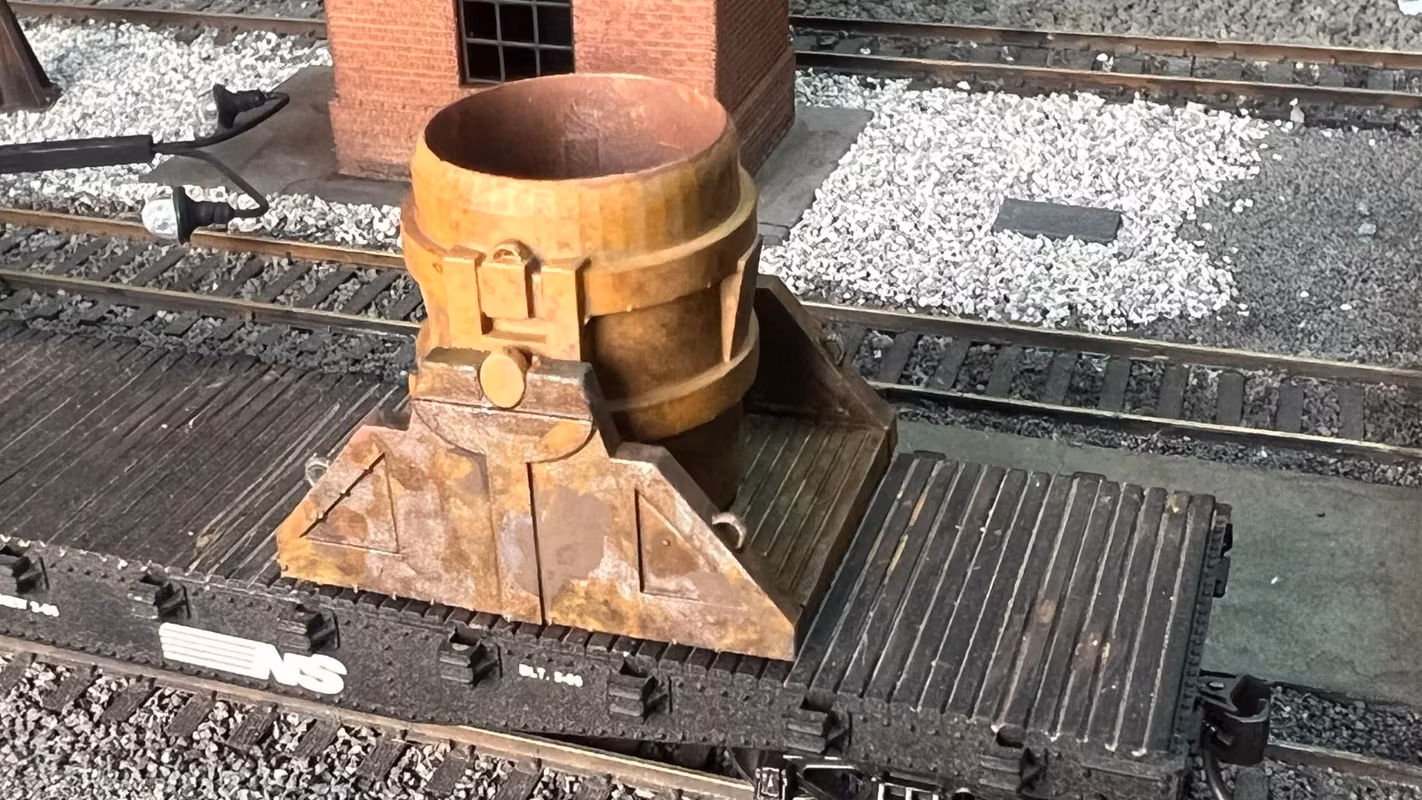 Photo of an HO Scale 3D printed model of a steel mill ladle on a pallet for a model railroad