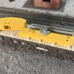 Photo of a HO Scale 3D printed model of an oil pump on a pallet for a model railroad