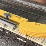 Photo of a HO Scale 3D printed model of an oil pump on a pallet for a model railroad