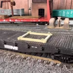 HO scale generator flat car load with cradle and chain tie downs cradle close up