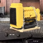 HO scale generator flat car load with cradle and chain tie downs close up