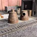 HO scale steel mill furnace hood with real rust detail in rail yard