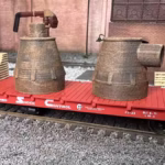 HO scale steel mill furnace hood with real rust detail on rail car