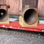 HO scale steel mill furnace hood on pallet with real rust detail on rail car bottom view