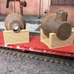 HO scale steel mill furnace hood on pallet with real rust detail on rail car end view