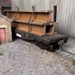 HO Scale steel mill H beam flat car load in yard on flat car with real rust