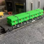 HO scale large pipe car load green right view - ScaleRail3D