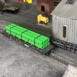 HO scale large pipe car load green top yard - ScaleRail3D