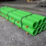 HO scale large pipe car load green yard view - ScaleRail3D